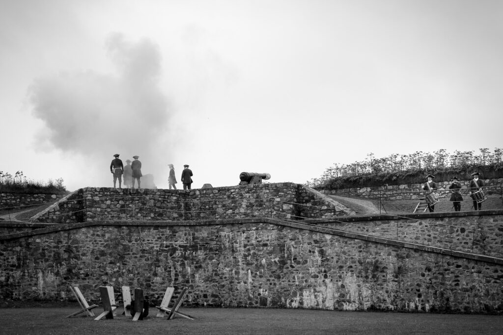 Costumed animators watching as the firing of the canon takes place. 