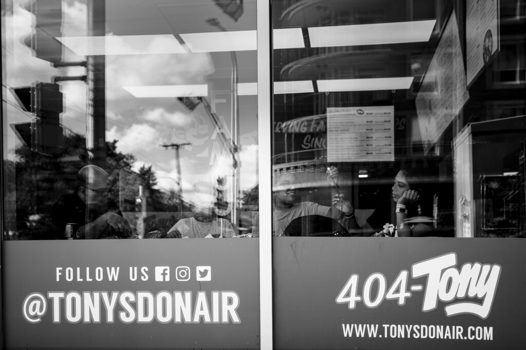Three girls enjoying some donairs at Tony Donair in Halifax. 