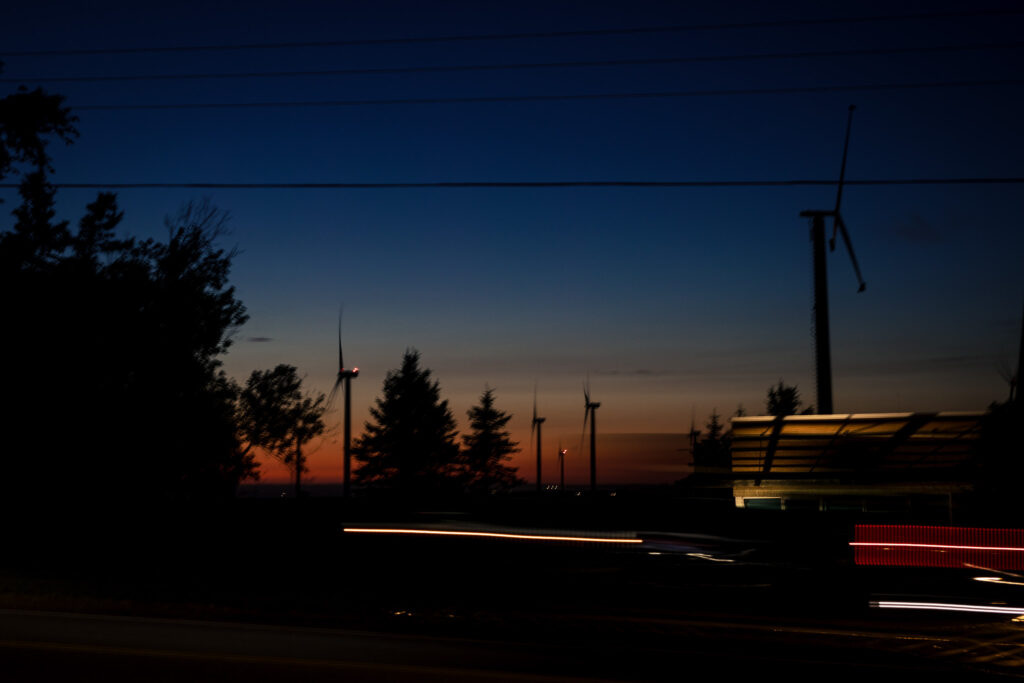 Night scene of windmills right after the sun has set. 
